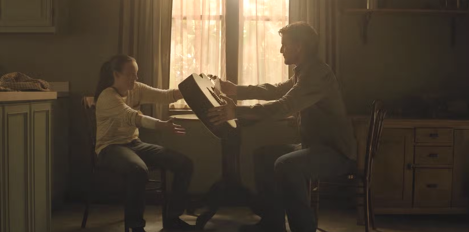 Joel teached Ellie how to play a guitar.